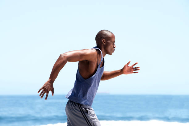 istock african american male runner outside by sea 937965718