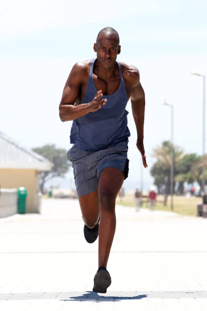 istock african american man running outdoors 937965724