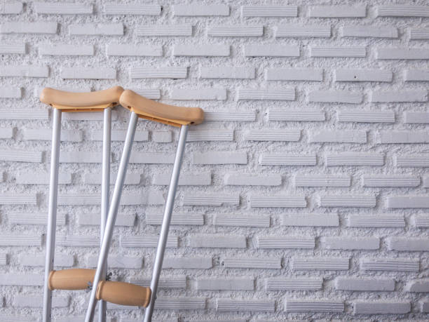 crutch on the white brick wall