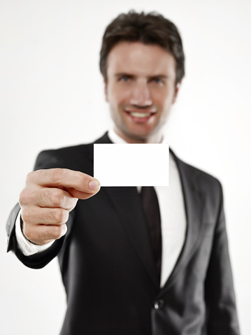 Young businessman showing his business card