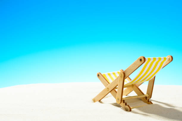 istock Sun lounger on the sandy beach 937975904