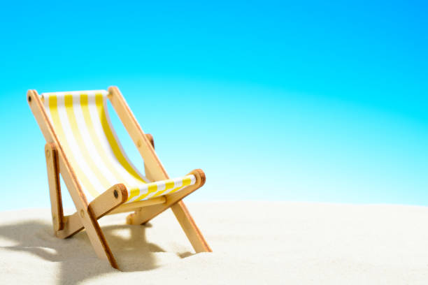 istock Sun lounger on the sandy beach 937975908