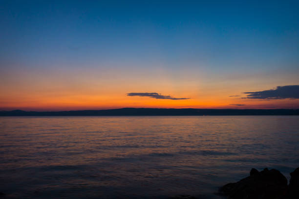 istock Sunset or sunrise at ocean beach landscape. 937982866