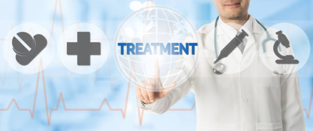 istock Doctor Points at TREATMENT with Medical Icons 937982956