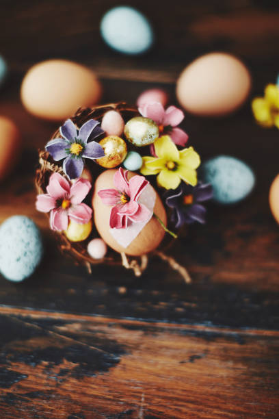 A vibrant Easter tree adorned with numerous colorful eggs hanging from its branches.