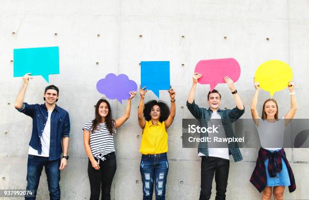 Group Of Young Adults Outdoors Holding Empty Placard Copyspace Thought Bubbles Stock Photo - Download Image Now