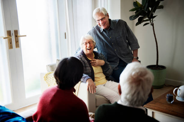 istock Senior people talking in living room 937992200