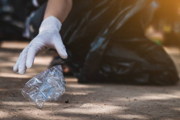 istock Women volunteer help garbage collection charity environment. 937992252