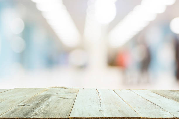 istock Wooden Board Empty Table Blur in Coffee Shop 938004686