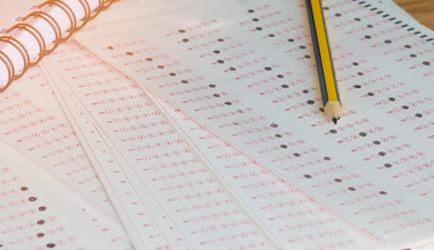 istock answer sheet, test score sheet for exam with answers in education 938007210