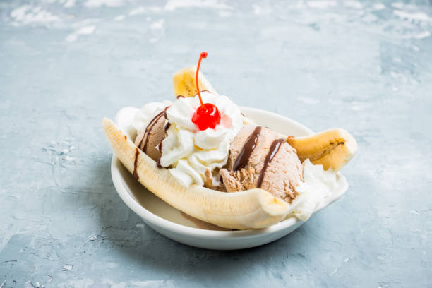 istock Homemade banana split with on the rustic background 938007758