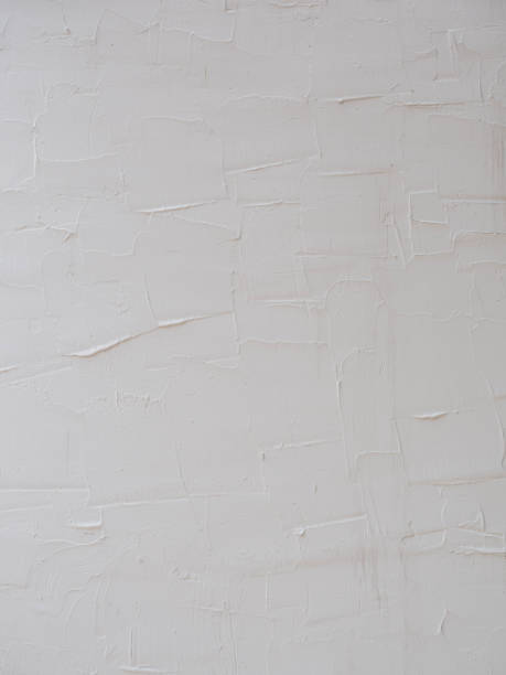 istock Closeup of white textured concrete wall texture 938009290