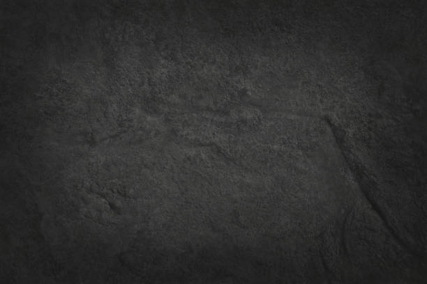 istock Dark grey black slate texture in natural pattern with high resolution for background and design art work. Black stone wall. 938023644