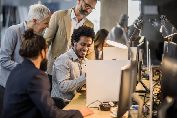 istock Happy business colleagues cooperating while working at corporate office. 938024428