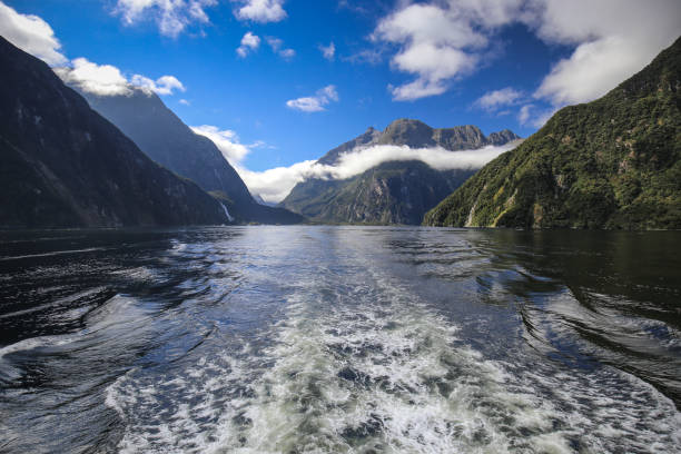 istock High cliffs of Milford Sound seen from a boat 938026714