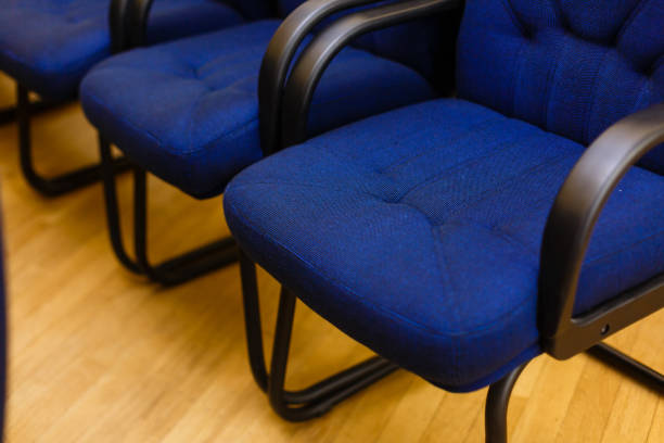 istock Rows of chairs at a conference, in an audience or at a training 938026920