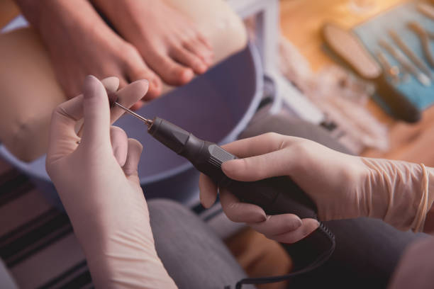 istock Female hands keeping appliance for visitor feet 938027790