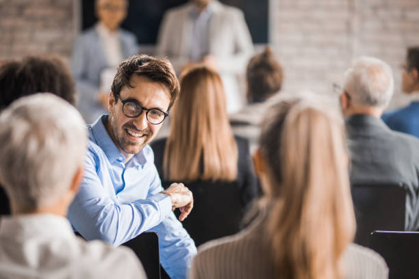 istock Young happy businessman attending a training class in a board room. 938038320