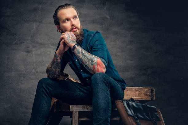 istock Bearded male with tattoos on arms. 938041116