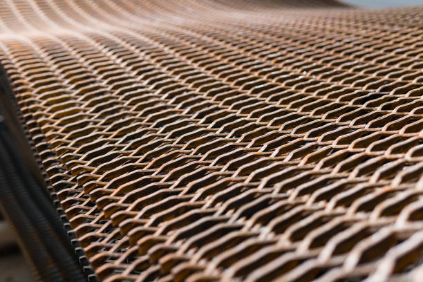 Stacked heavily rusty metal wire grid on a construction site