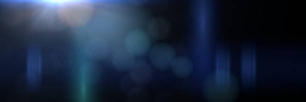 istock bright blue lens flare effect banner with bokeh effects, overlay texture in front of a black background 938041528