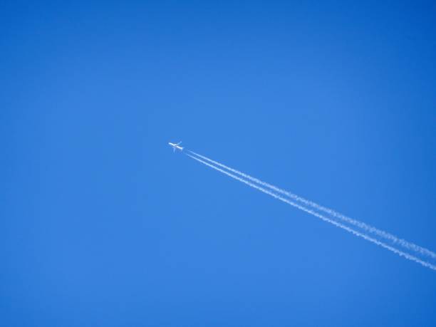 istock airplane and vapor trail 938050756