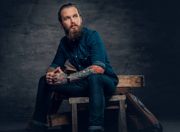 istock Bearded male with tattoos on arms. 938053456