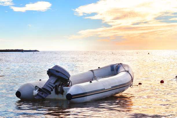 istock Inflatable boat with a motor in the bay 938056342