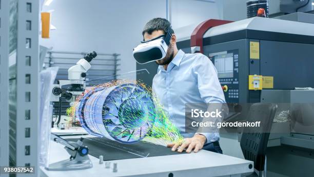 Factory Chief Engineer Wearing Vr Headset Designs Engine Turbine On The Holographic Projection Table Futuristic Design Of Virtual Mixed Reality Application Stock Photo - Download Image Now