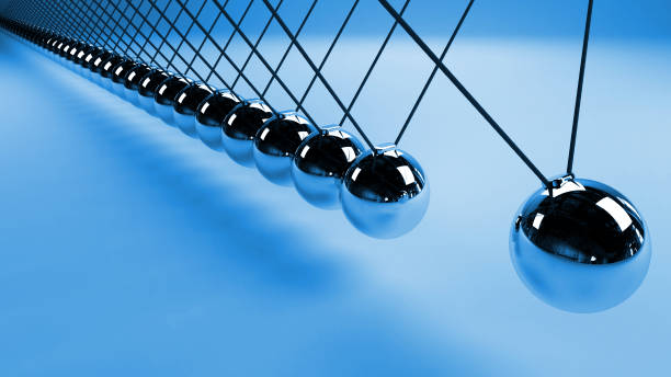 Newton's cradle, action and reaction concept, metal balls in motion (blue 3d render background)