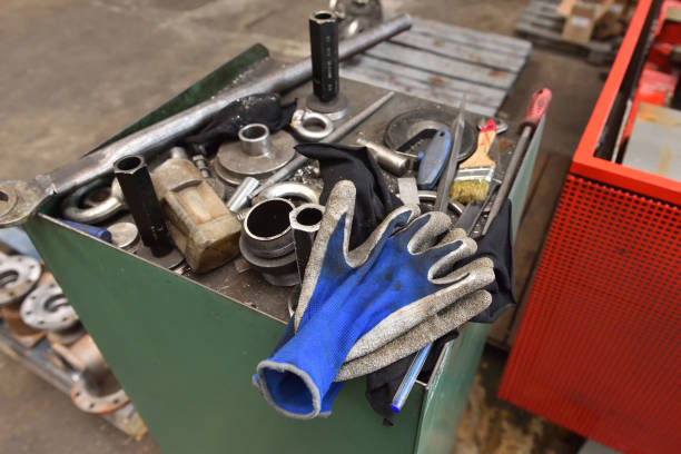 istock Dirty blue gloves lie next to the tools 938064586