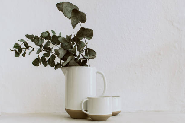 istock Rural abstract background with vases and eucalyptus brunches . Rustic scene 938064614
