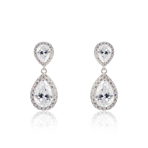 Fashion Jewellery Pair of silver diamond earrings isolated on white background earring stock pictures, royalty-free photos & images