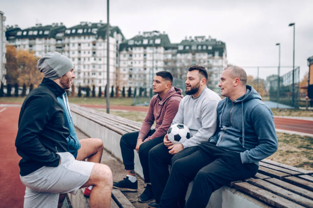 istock Best friends playing socceer on streets 938067966