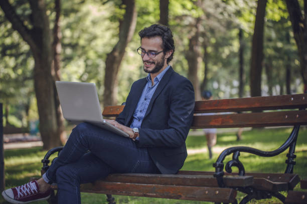 istock Businessman in public park 938068066