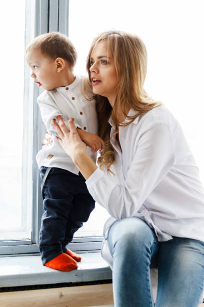 istock Mom and baby having fun at home 938068380