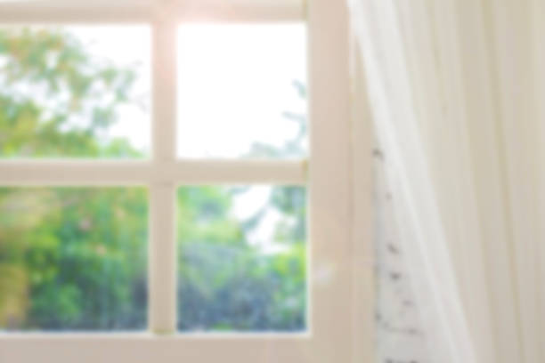 istock Defocused window background with white curtains in morning time. 938068620