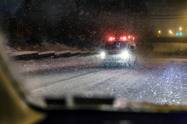 istock Winter Night Blizzard Approaching Emergency Services Ambulance 938071814