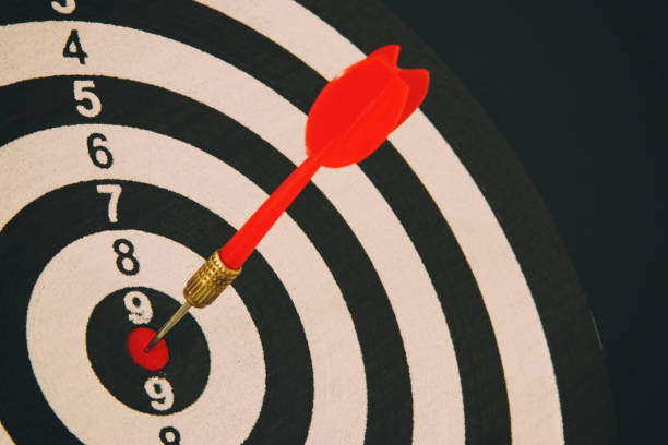 istock Red darts arrow in the target center. 938072118