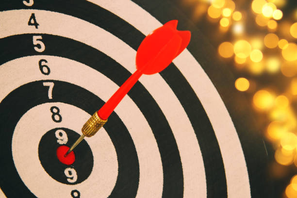istock Red darts arrow in the target center. 938072590