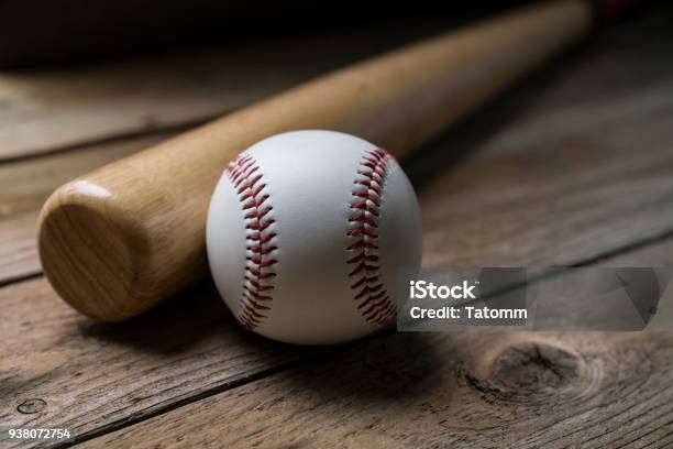 Baseball And Baseball Bat On Wooden Table Background Close Up Stock Photo - Download Image Now