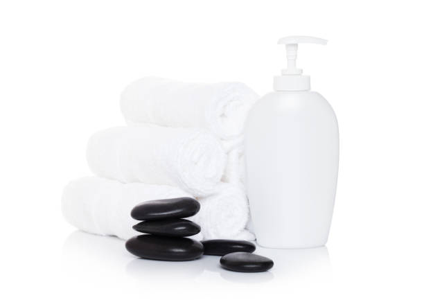 istock Plastic bottle of organic shampoo with spa towels 938075826