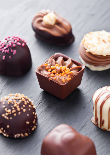 istock Luxury white and dark chocolate candies variety 938075864