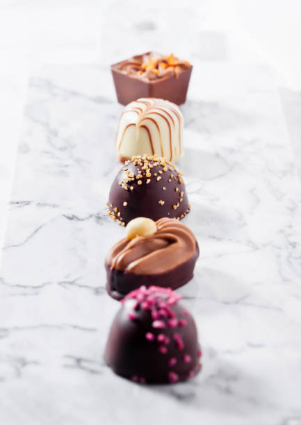 istock Luxury white and dark chocolate candies variety 938079220