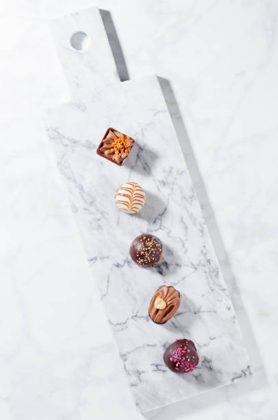 istock Luxury white and dark chocolate candies variety 938079644