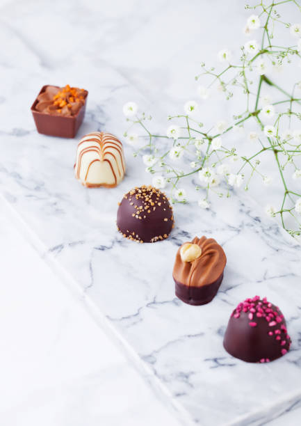 istock Luxury white and dark chocolate candies variety 938081982
