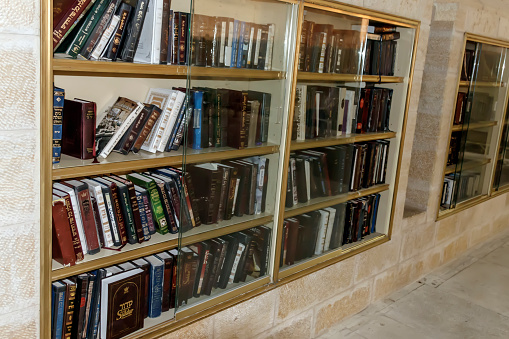 Bookshelves with books for prayers at the Western Wall in Jerusalem Israel