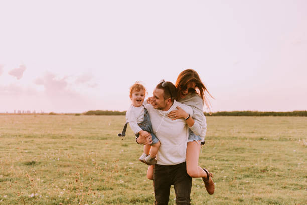 istock Young family spending time together in green nature 938092956
