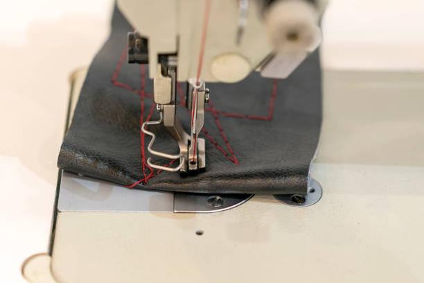 istock Closeup the sewing machine and item of clothing 938093006