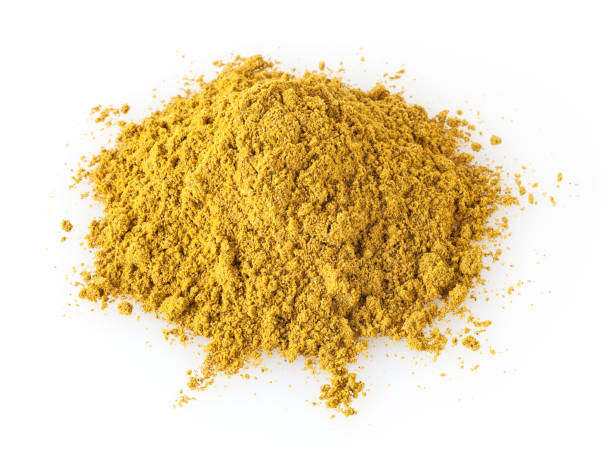 istock Heap of curry powder isolated on white background 938093008